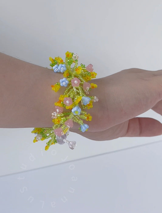 Handmade floral bracelet with yellow-green Miyuki bead vines and pink Czech glass flower accents